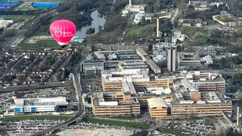 Nottingham Organ Donation Team "Betty" flying over the Queen's Medical Centre, Nottingham
