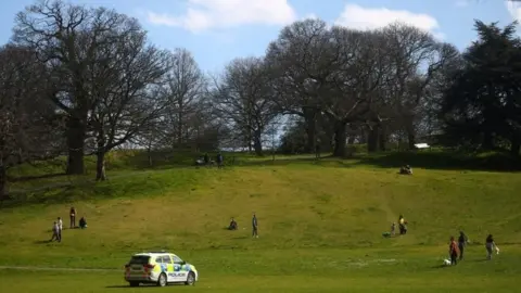 Reuters A Police car is seen in Greenwich Park, as the spread of the coronavirus disease (COVID-19) continues, London, Britain, April 4, 2020.