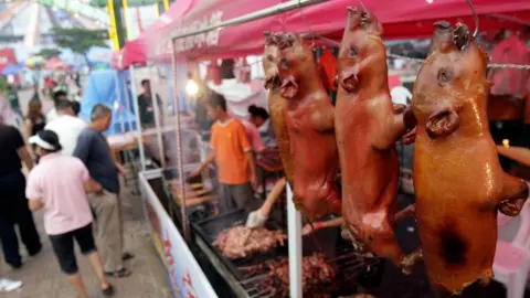 Getty Images Cooked pigs