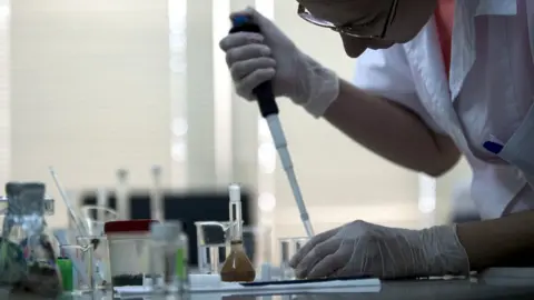 NIKOLAY DOYCHINOV/AFP/Getty Images Scientist test the content of food samples at a laboratory