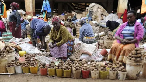 AFP Women selling potatoes in Nairobi