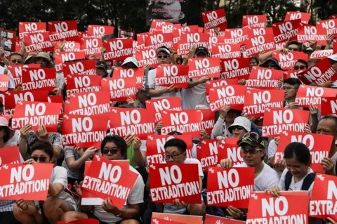 Getty Images Protesters attend a rally against a controversial extradition law proposal in Hong Kong on 9 June 2019