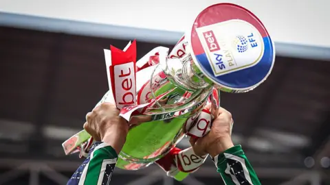 The Championship play-off final trophy being lifted
