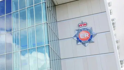 The front of GMP HQ which is partly all glass with white panels which have the force logo on them.