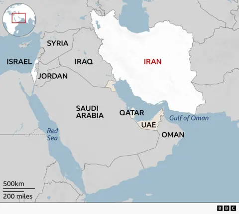 A regional map highlighting Iran in white with its name in red. Surrounding countries are labeled in grey, neighbouring Iraq to the west and other Middle Eastern countries including Syria, Jordan, Israel, Gaza and Saudi Arabia, Qatar, UAE, and Oman. Bodies of water such as the Red Sea and the Gulf of Oman are marked in blue