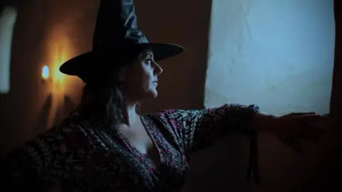 Stephen Hart Carys in a witches hat