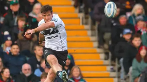 AJ MacGinty takes a kick during Bristol's win against Leicester