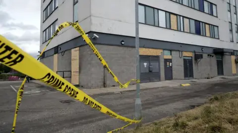 Chris Furlong/PA Wire Yellow police Crime Scene tape outside Holiday Inn Express at Manvers in aftermath of violence