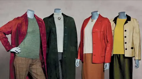 Mannequins wearing four colourful mod outfits from the 1960s