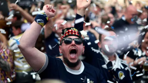 Scotland fans celebrating at the Glasgow Fan Zone after Scott McTominay scored a goal in Scotland's Uefa Euro 2024 game against Switzerland on June 19, 2024.