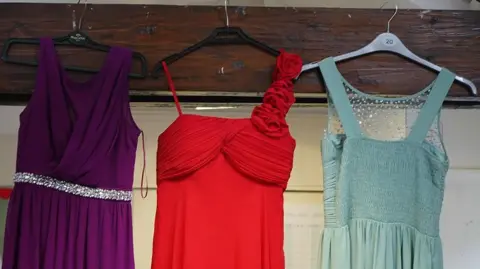three of the dresses available to pupils struggling to go to the prom
