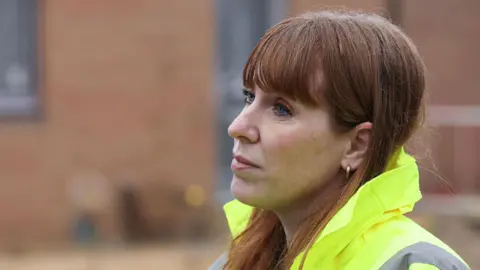 PA Media Angela Rayner, Secretary of State for Housing, Communities and Local Government, wearing a hi-vis jacket