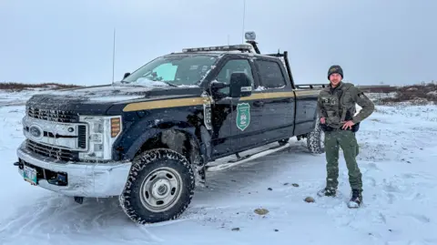 Victoria Gill/BBC Sergeant Ian Van Nest from Churchill's Polar Bear Alert Program 