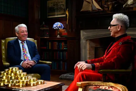 Getty Images John Bercow and Alan Cumming facing each other and sitting down 