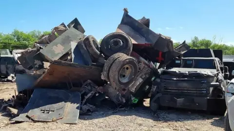 Mexican Federal Prosecutor's Office View of a destroyed monster truck