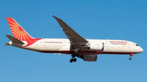 FILE PHOTO: The Air India Boeing 787 Dreamliner plane that crashed in Ahmedabad on June 12, 2025, flies over Melbourne, Australia, on December 29, 2024, in this handout picture
