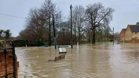 Supplied Cars submerged in flood waters in Bottesford, Leicestershire