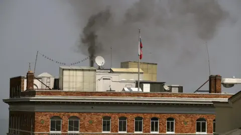 Getty Images Black smoke billows from a chimney on the Russian consulate, September 1, 2017 in San Francisco, California