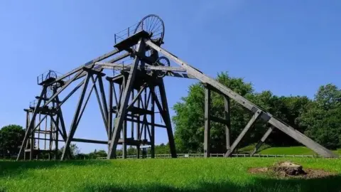 Ian Castledine Colliery headstocks standing tall in a green field