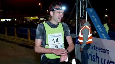 Manx Radio Paul Atherton crossing the finishing line