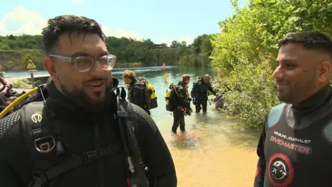 Usman Zahid (left) with Mohammed Salim Patel in their wet suits after scuba diving