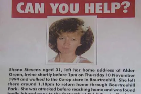 Printed out appeal poster from the time of Shona Stevens murder, showing a picture of a woman with very curly red hair, reading "CAN YOU HELP? Shona Stevens aged 31, left her home address at Alder Green, Irvine shortly before 1pm on Thursday 10 November 1994 and walked to the Co-op store in Bourtreehill. She left there around 1.10pm to return home through Bourtreehill Park. She was attacked before reaching home and was found badly injured near to the footpath at Ochil Court. She later died in hospital"