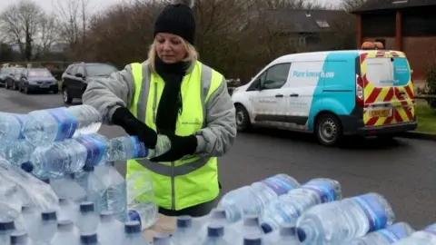 PA Volunteers from South East Water distribute water bottles