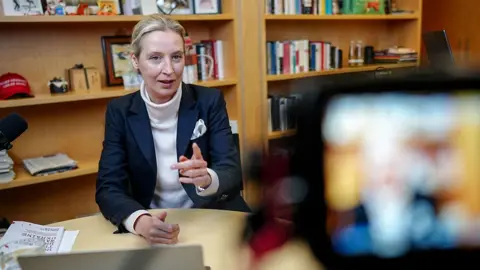 Alice Weidel, co-leader of Germany’s far-right party AfD (Alternative fuer Deutschland) is pictured in her office before a virtual talk event with U.S. billionaire Elon Musk on his platform X in Berlin, Germany, January 9, 2025