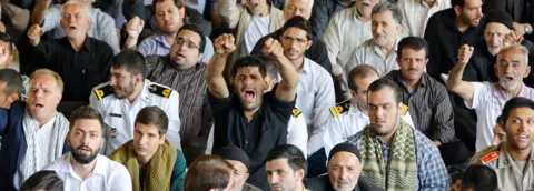 AFP Iranian worshippers shout anti-US slogans during the weekly Friday prayer in Tehran on 13 October 2017