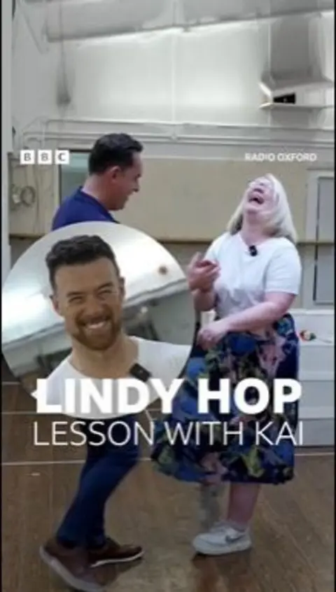 A man and a woman are learning to dance.