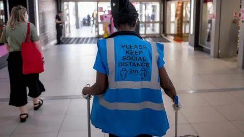 Getty Images A sign on a hi-vis jacket of a worker in Walthamstow, London