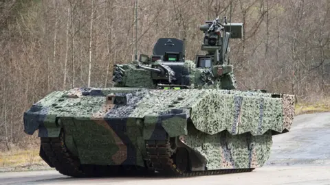 PA Media An Ajax armoured fighting vehicle 