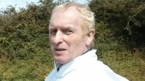 FAMILY HANDOUT Wallis Webb, pictured wearing a white shirt with bushes in the background