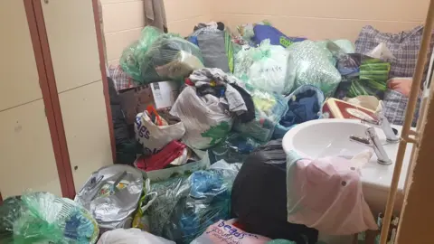 Almost every part of the community centre has been filled with donations for people in the valleys