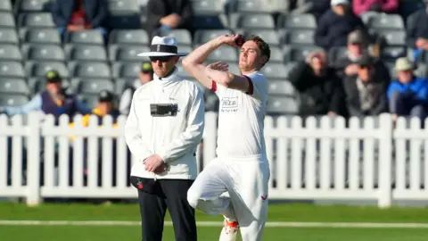 Lancashire bowler George Balderson running into bowl against Gloucestershire.