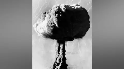 Getty Images A black-and-white photo of a mushroom cloud at Maralinga in 1956