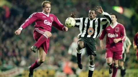 Getty Images Liverpool's John Scales challenges Tino Asprilla of Newcastle