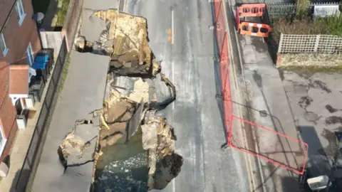 Eddie Mitchell A drone image of the sinkhole in Godstone, Surrey.