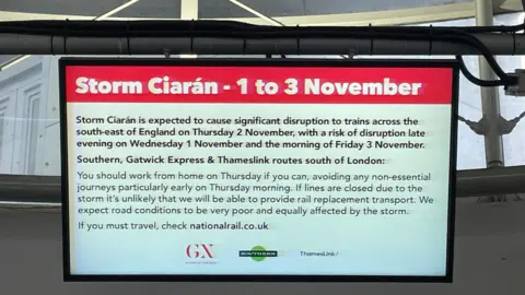 Adrian Harms Sign and Redhill station
