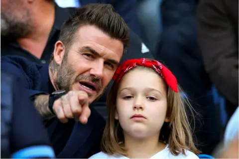 Getty Images David Beckham and Harper Seven