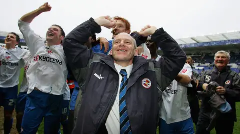 Getty Images Steve Coppell, manager of Reading and his team celebrate after gaining promotion to the premiership after the Coca-Cola Championship match between Leicester City and Reading at the Walkers Stadium on March 25, 2006 in Leicester, England. 