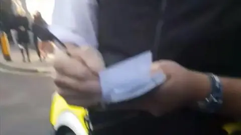 Jack Durston Police officer writing notes