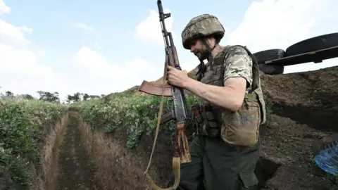 Getty Images A Ukrainian soldier near Mykolaiv