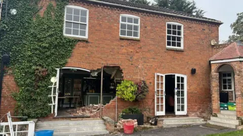 Harriot Bolland The damage caused by a digger driving into the restaurant