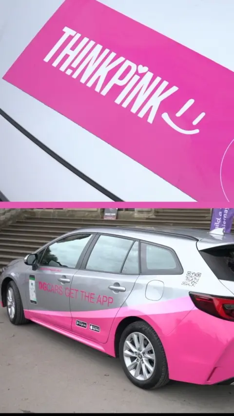 Silver taxi with pink stripe