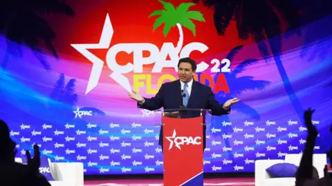 Getty Images Florida Republican Governor Ron DeSantis addresses attendees on day one of the 2022 Conservative Political Action Conference (CPAC) in Orlando.