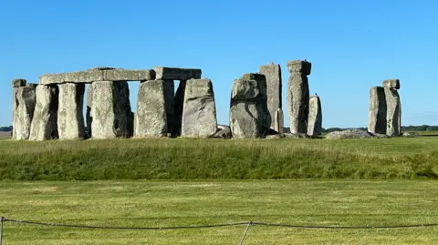 BBC Stonehenge under a blue sky