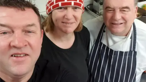 Bruce Reid Bruce Reid (left) with other volunteers