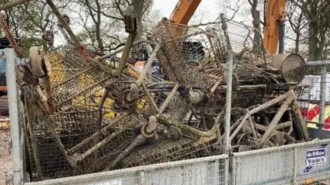 Environment Agency Rusty shopping trolleys in a trailer