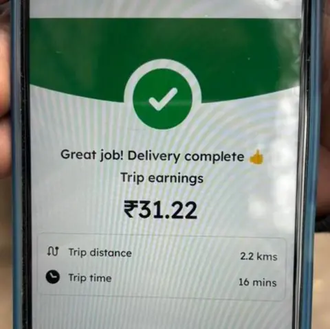 The screen of a blinkit driver's phone showing how much he made in a delivery